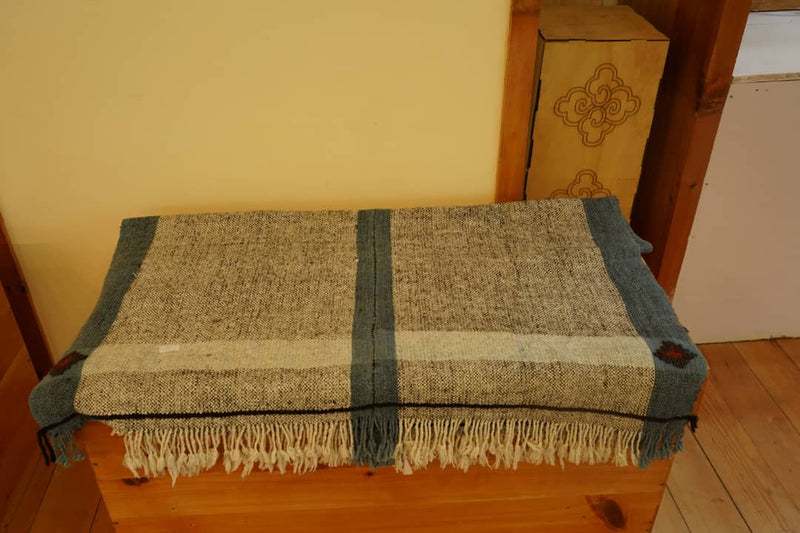Local sheep and yak wool rug, colors of Bhutan